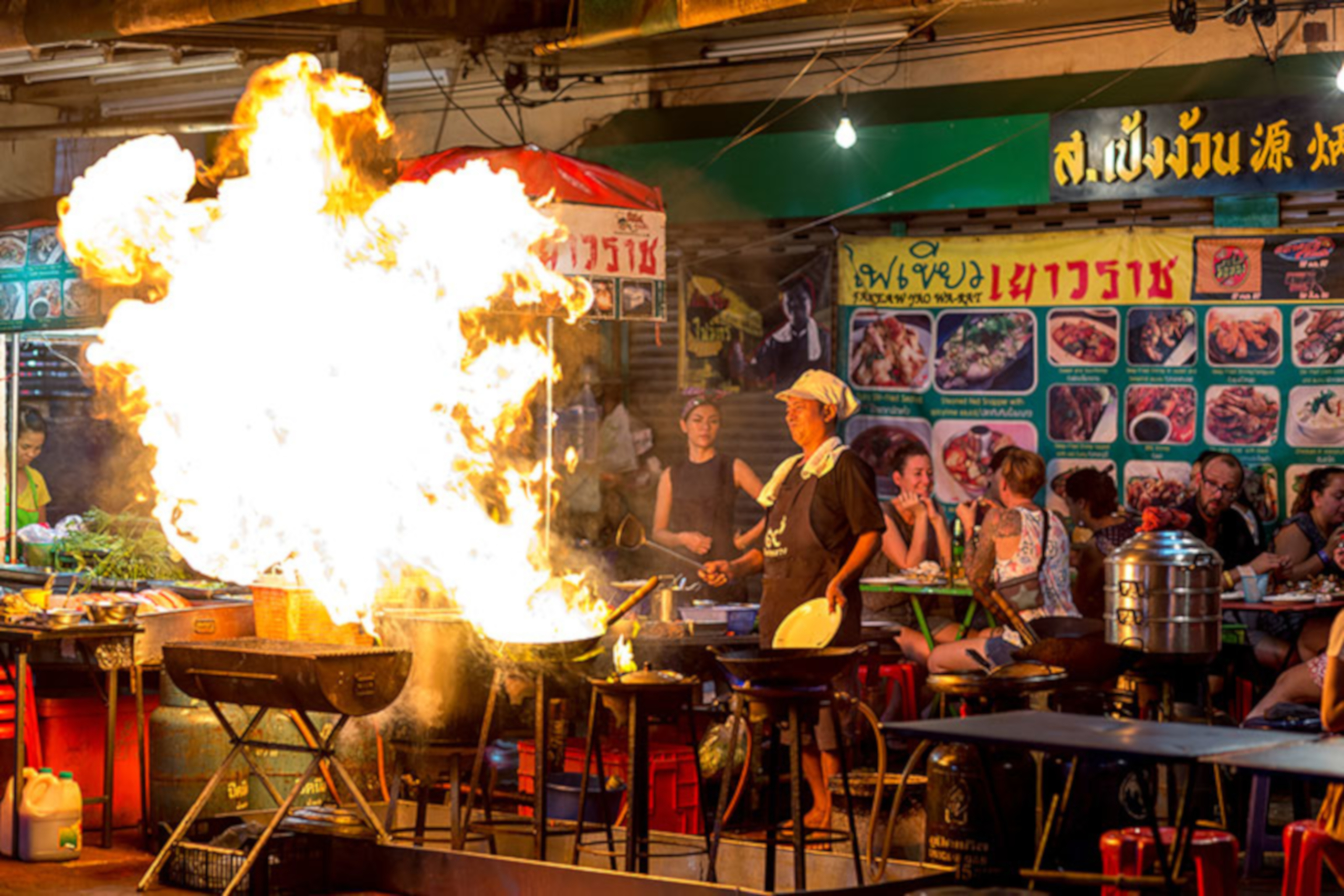 Chef cooking with flame rising